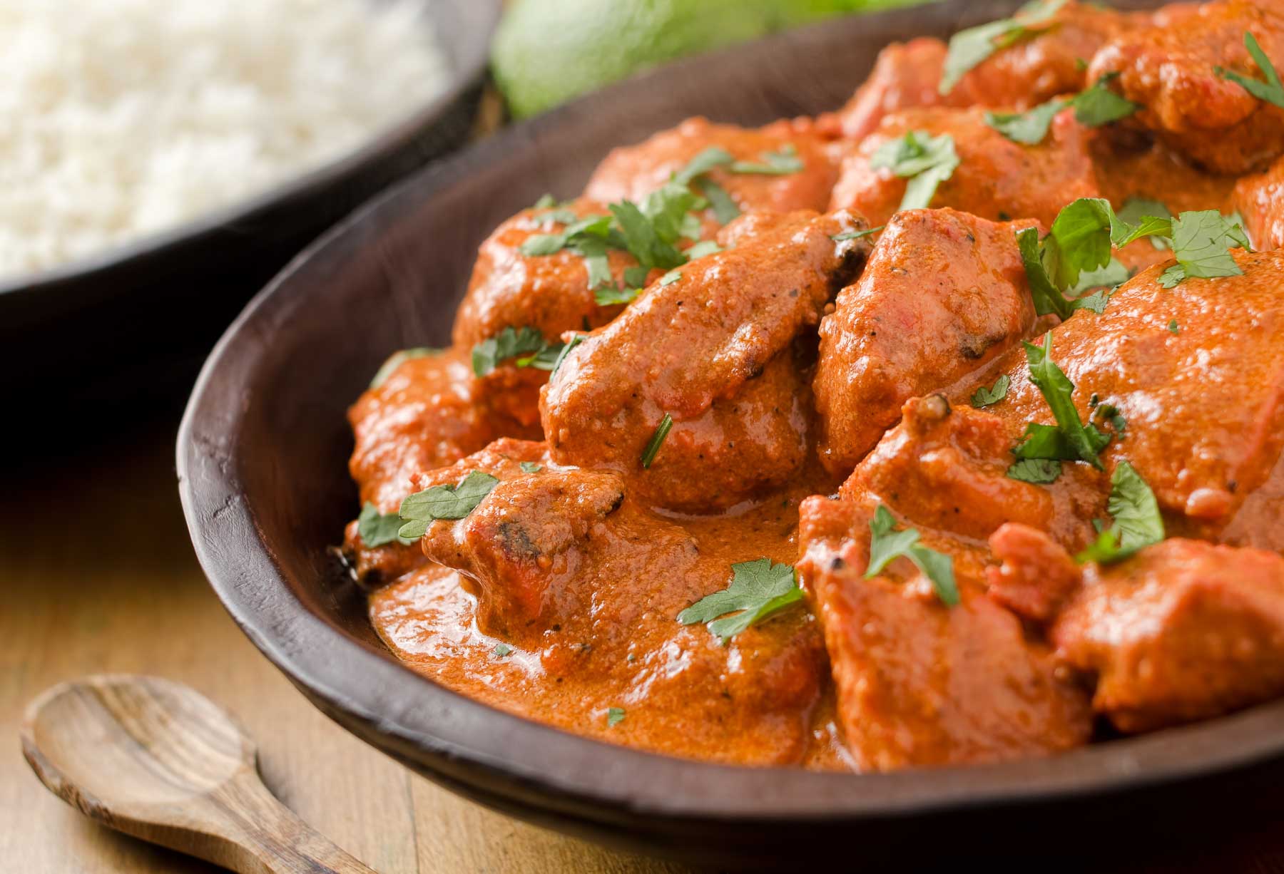 Creamy butter chicken curry with basmati rice. - Mehfil Indian